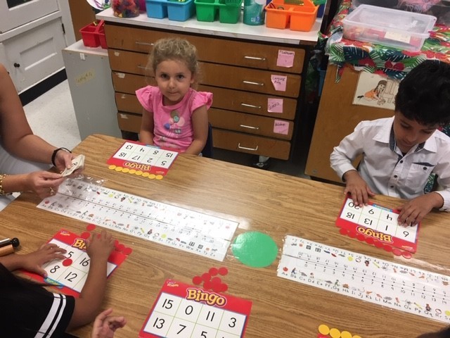 Photo of kindergarten students doing math activities