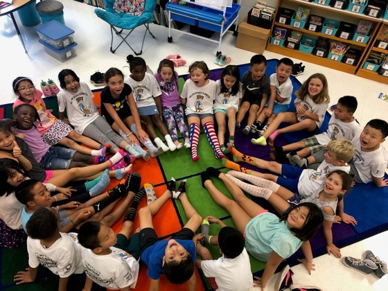 students sitting in circle with crazy socks
