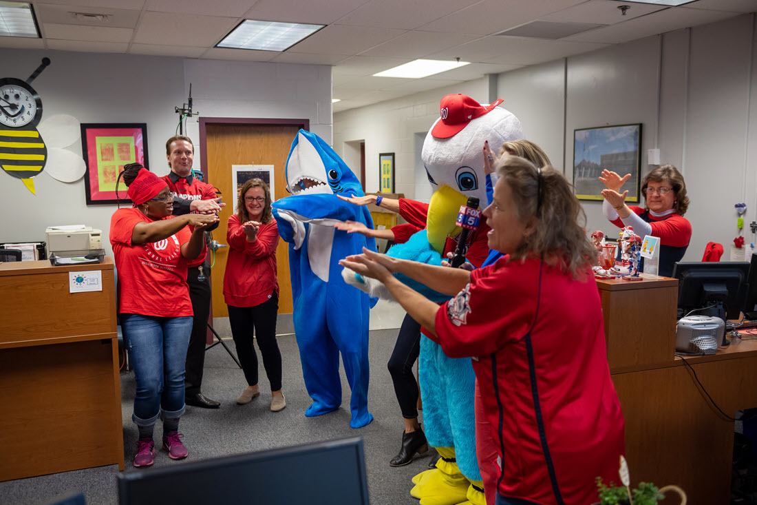 Glen Forest ES staff perform Baby Shark clap during a live television interview.