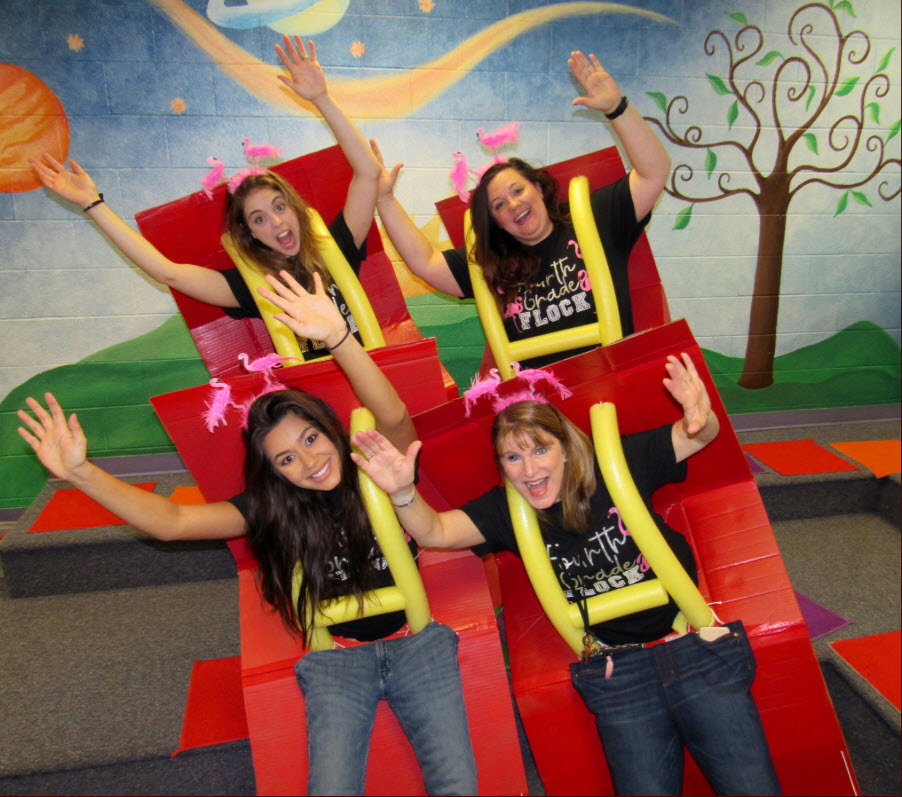 Lemon Road ES staff dressed as seats on a roller coaster