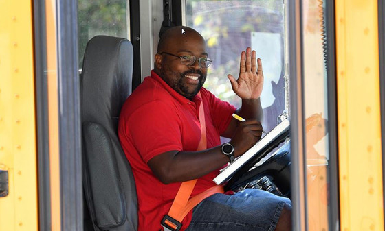 Bus driver behind the wheel of a bus