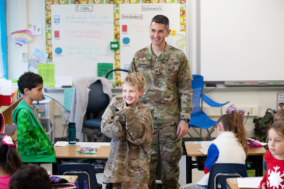 Students interact with members of the armed forces during classroom demonstrations. 