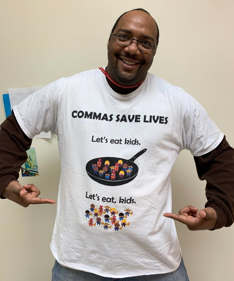 Maurice Hubbard, teacher at Cardinal Forest ES, wearing a shirt that shows the importance of comma placement in a sentence.