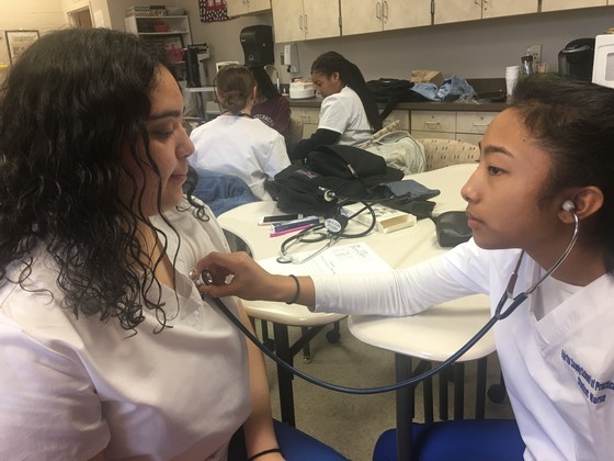 Picture of students taking vital signs