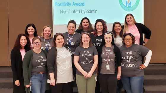 staff wearing future is inclusive t-shirts