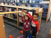 photo of students holding a gingerbread man