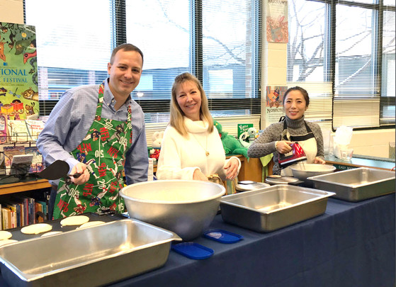 Fairfax Villa ES staff serve pancakes.