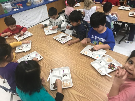 Students decorating cookies