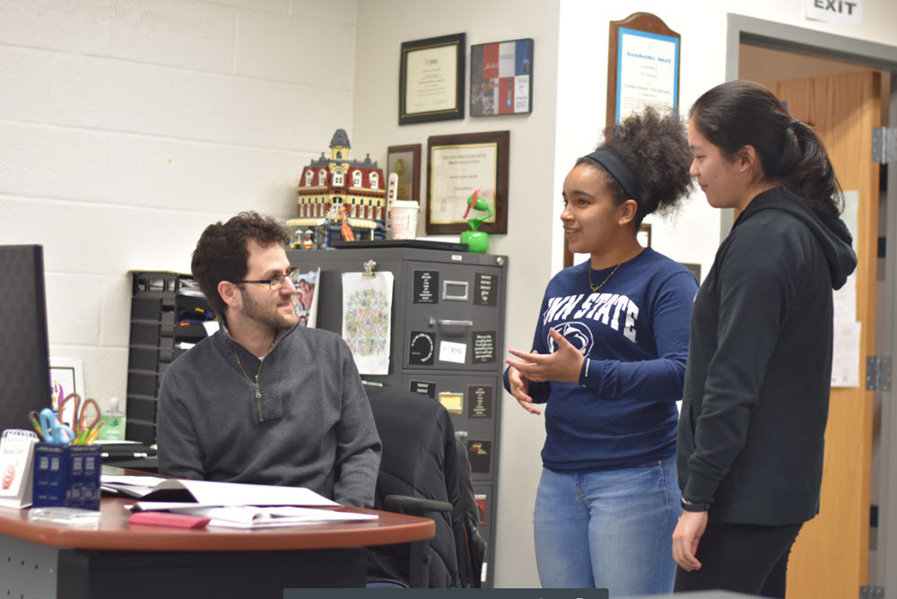 Dan Reinish, Marshall HS teacher, talking with students