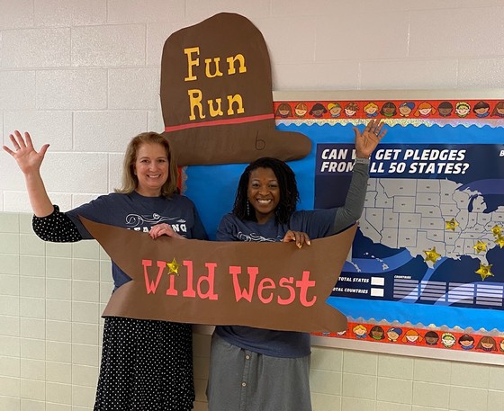 Admin posing with fun run items