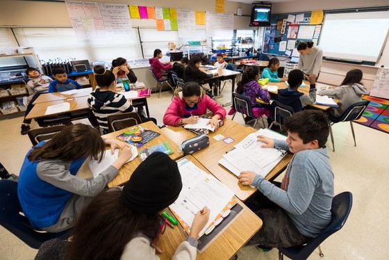 Fifth graders working at their desks.