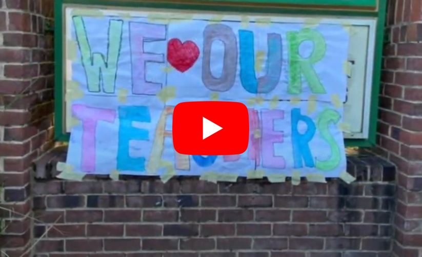 YouTube button on a sign saying "We [heart] our teachers.
