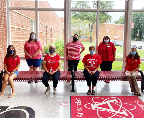 Annandale HS staff sitting in front of a window
