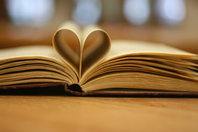 Book with pages folded as a heart
