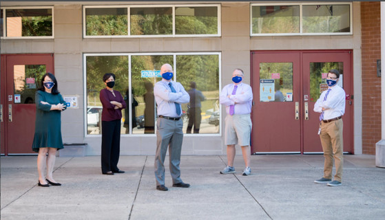 Liberty MS administrators outside of the main entrance.