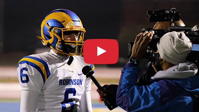 Robinson football player being interviewed.