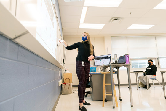 Teacher at smart board.