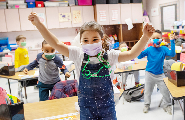 Girl with arms in the air.