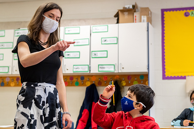 photo of teacher and a student wearing masks