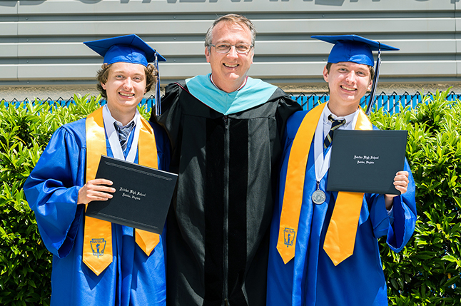 photo of Dr. Brabrand with his two sons at graduation