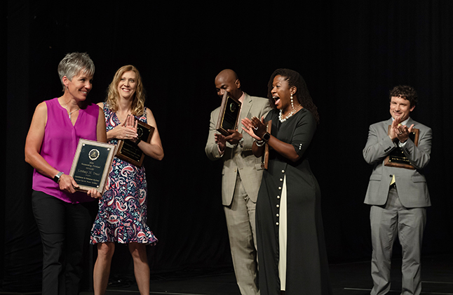 photo of principal Lindsay Trout receiving award at FCPS Honors