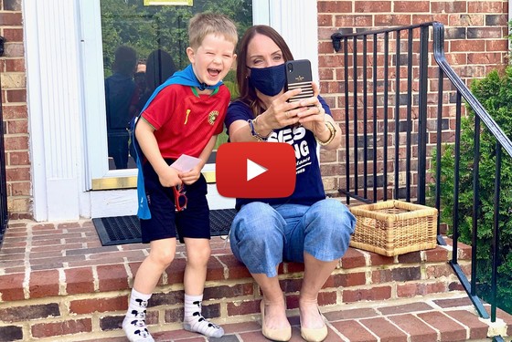 photo of principal and boy in cape