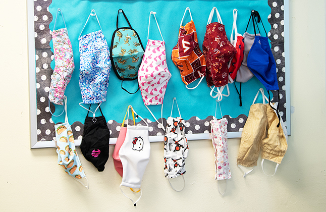 photo of masks hanging in a classroom