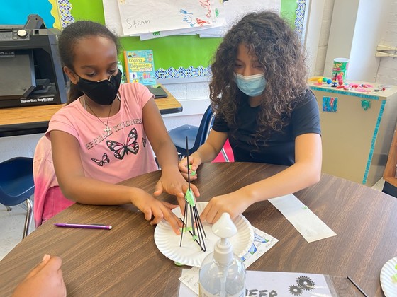 Photo of students in STEAM class working on a project