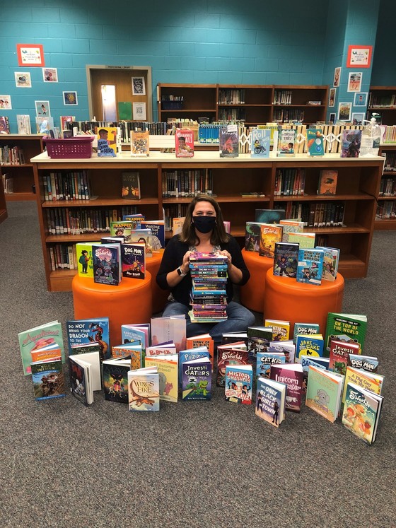 wses librarian with books