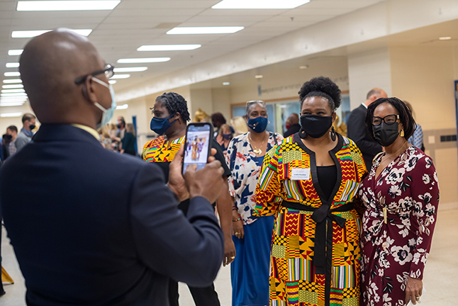 photo of gentleman taking a photo of award winner 
