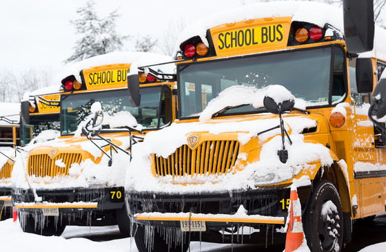 School buses in snow.