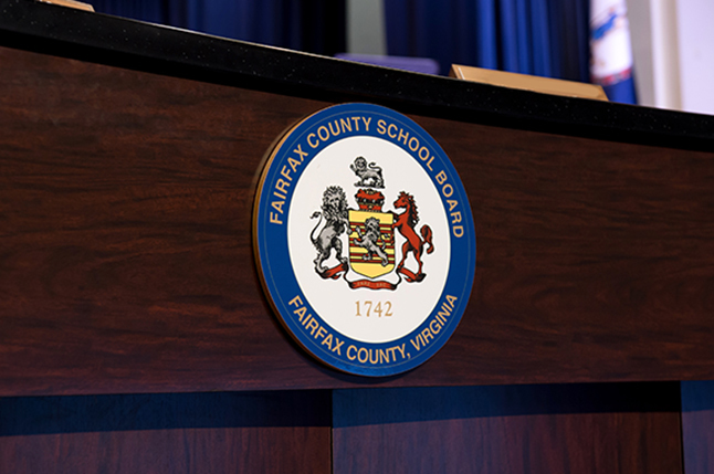 photo of school board desk with logo