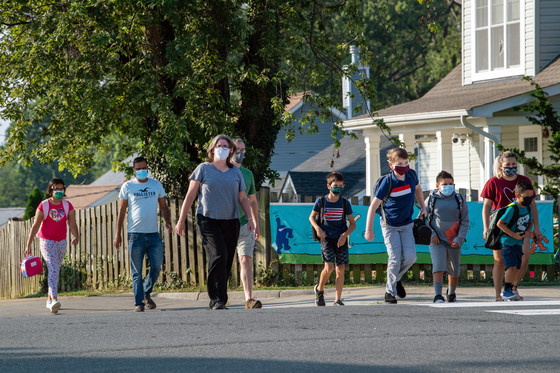 Students and parents walking to school.
