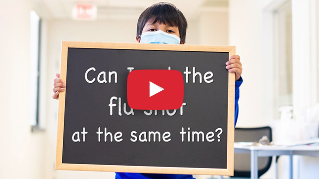photo of boy holding up sign saying "Can you get your vaccine with your flu shot"