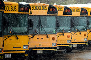 School buses in snow.