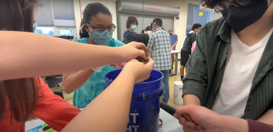 Photo of students collaborating on an engineering design challenge. 