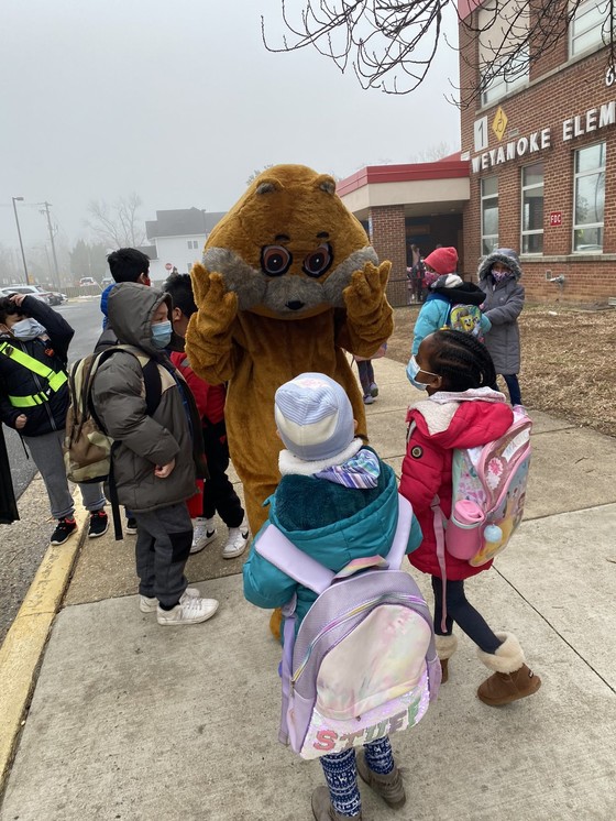 Photo of Woody the Woodchuck greeting students on Groundhog Day