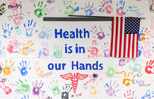 Student handprints on wall; Health is in our Hands