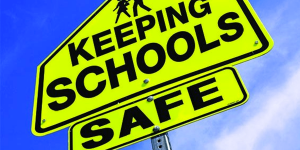 Keep schools safe street sign
