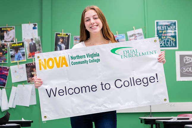 Student holding a NOVA sign.