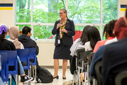 MIchelle Reid speaking in front of a group of students. 