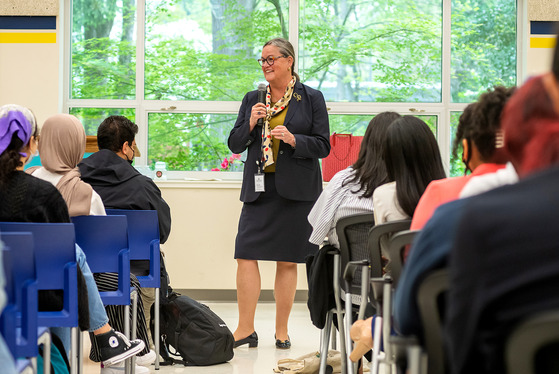MIchelle Reid speaking in front of a group of students.