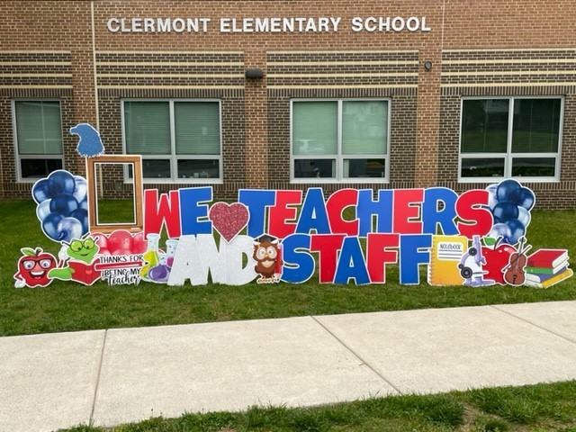 A large sign in front of Clermont says "We Love Teachers and Staff!"