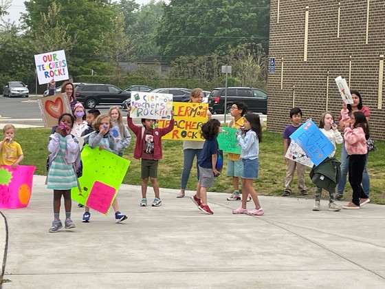 Clermont students cheer on their teachers as they arrive in the morning. 