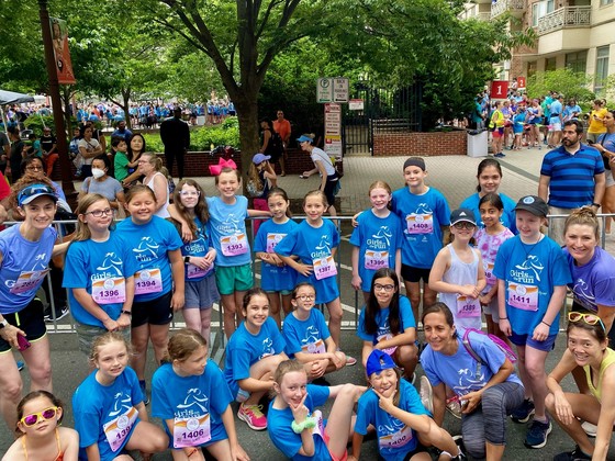 Girls on the Run group posing for a photo together.