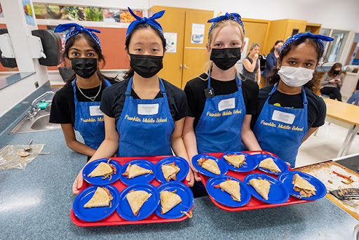 Four Franklin Middle School students show off their Real Food for Kids culinary challenge winning dish the Vegejita Wrapadilla.