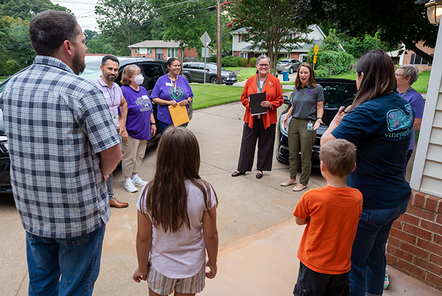 Dr. Reid and Dotty Lin greet families during a welcome walk