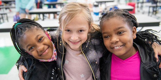 Three smiling young girls