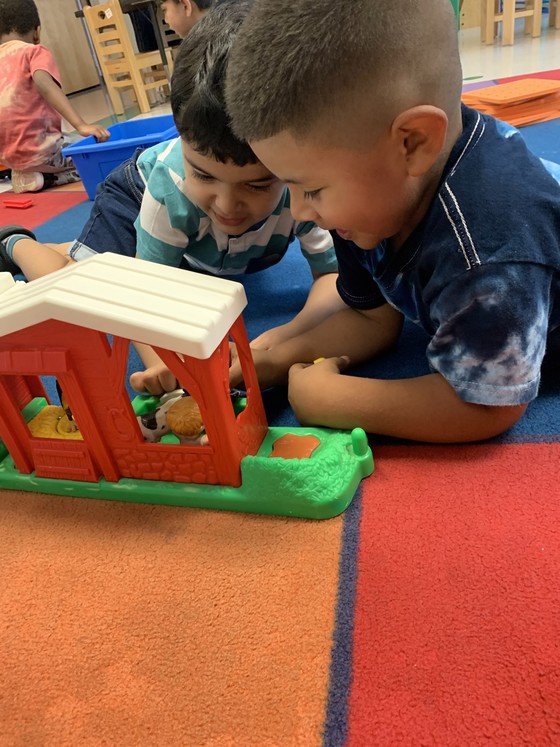 Photo of two preschool students playing together