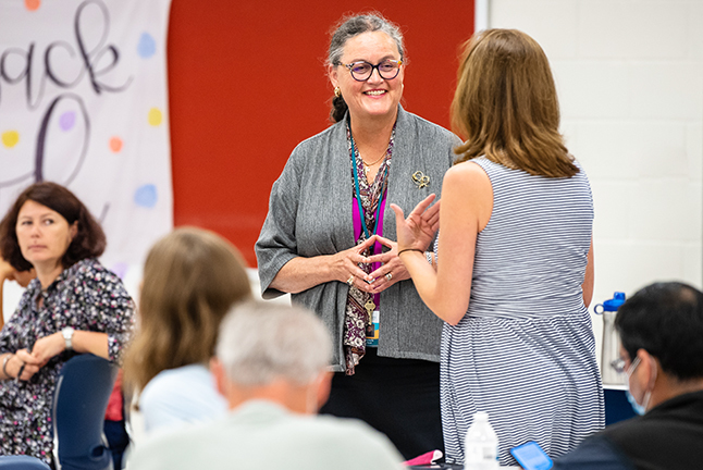 Dr. Reid talks to a community member